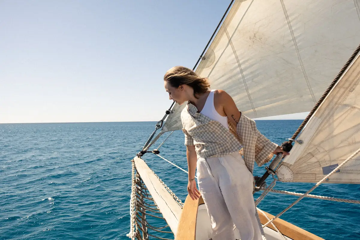 A sailor enjoying time on deck at sea
